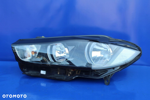 Reflektor lewy lampa lewa stan BDB OE Jaguar XE X760 Anglik GX7313W030GD