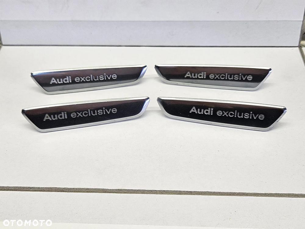 AUDI Q7 4L 05-15R ZNACZEK LOGO EMBLEMAT AUDI EXCLUSIVE PRAWY LEWY
