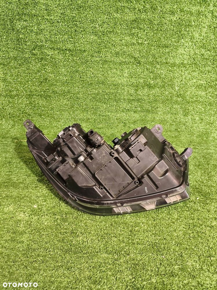 REFLEKTOR LEWY PRZÓD SSANGYONG TIVOLI 15- XENON NR.990 - 4