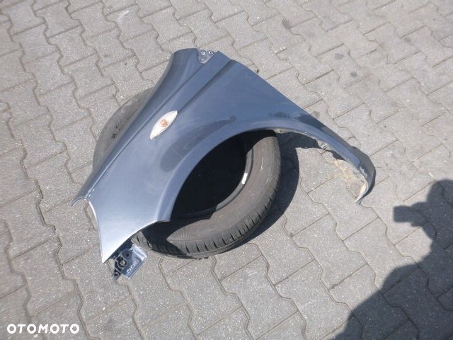 BŁOTNIK LEWY PRZÓD LEWY PRZEDNI TOYOTA YARIS I LIFT KOLOR 855 - 8