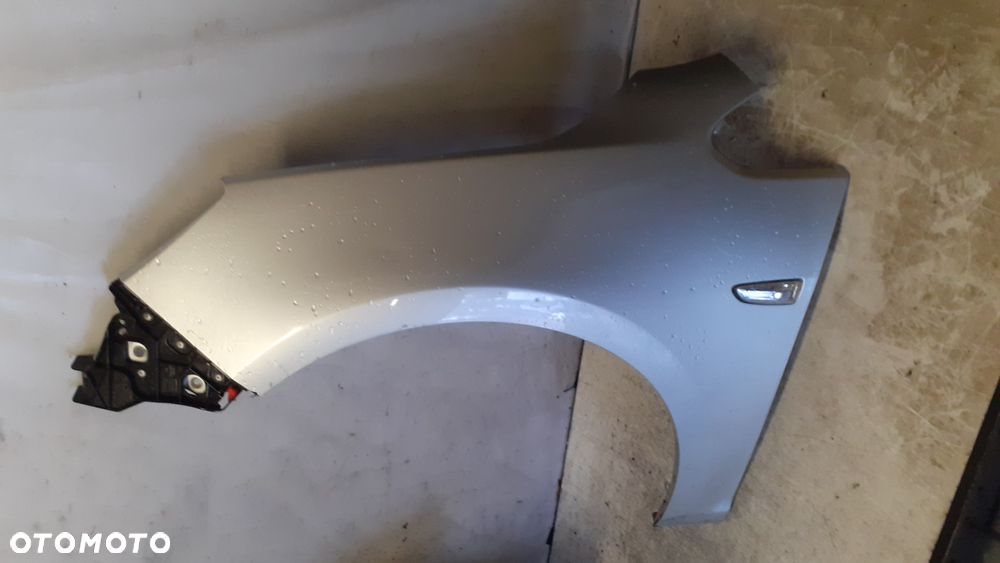 * BŁOTNIK LEWY OPEL ASTRA J IV LIFT  Z176 SREBRNY do malowania !!! - 2