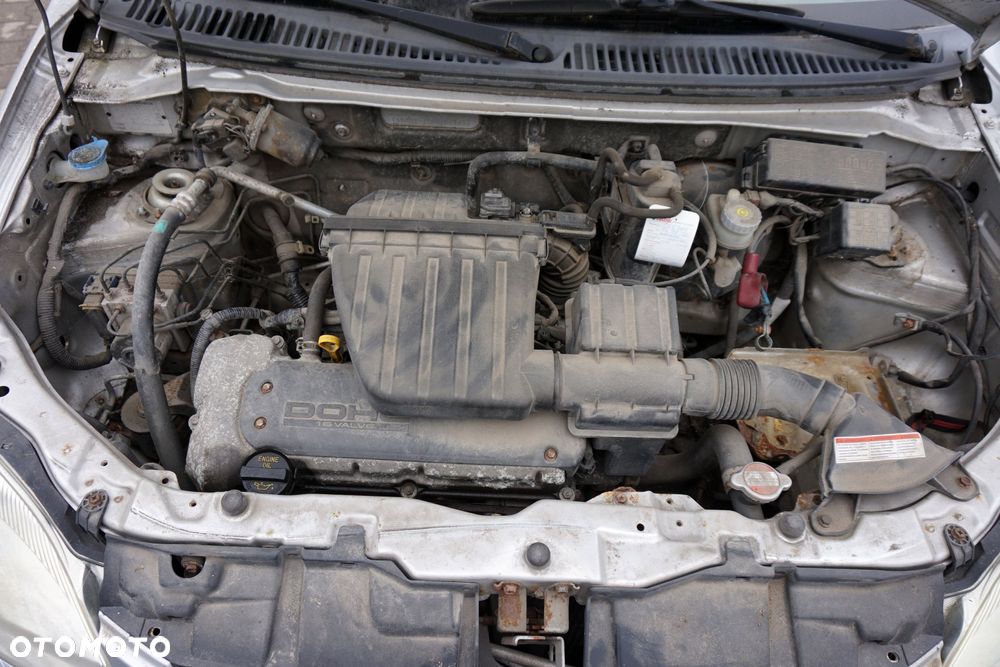 SUZUKI IGNIS II 2003 Z2S 1.3 16V M13A 94KM 2WD SREBRNY na części - 9