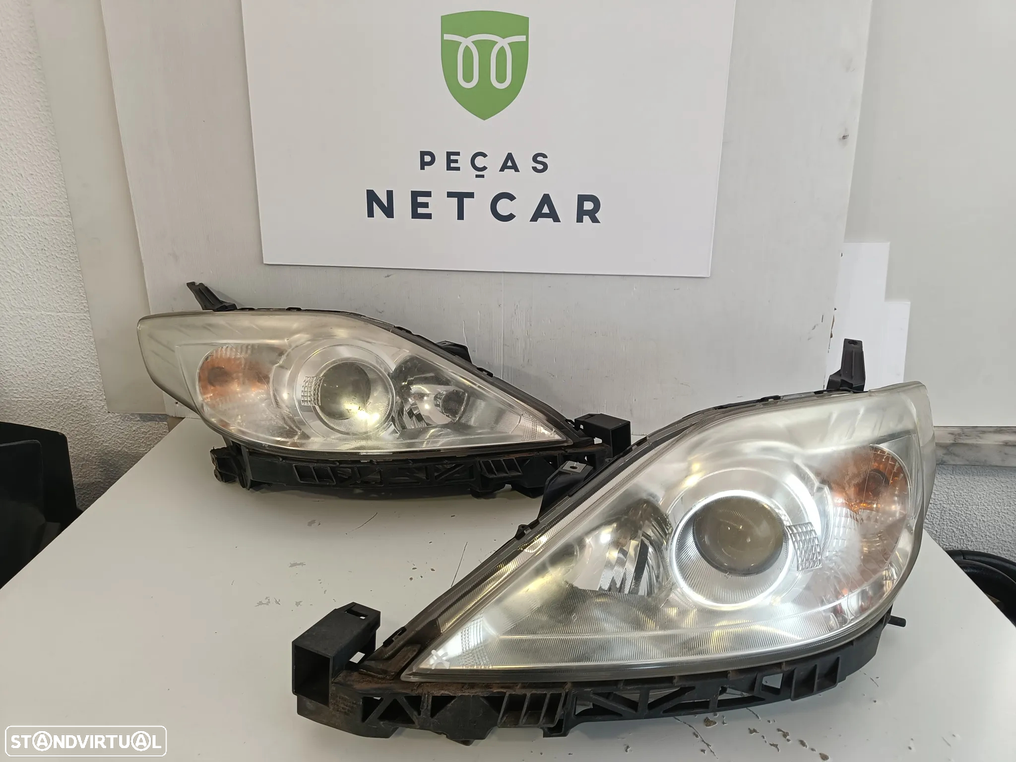 Farol óptica esquerdo Mazda 5 2009 - 2