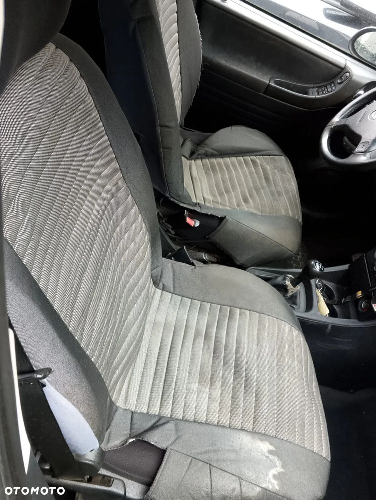 Opel Zafira A (99-03r.) 2.0 DTI 100KM. Silnik Y20DTH Skrzynia F23 WR lakier Z 151 / 94L.Cały na części.GWARANCJA !!! Przód Tył Zestaw Komplet Drzwi Klapa Zderzak Błotnik Maska Grill Atrapa Szyba Pas Lampa Lusterko Boczki Fotel Kanapa Kokpit Deska Rozdzielcza Przełącznik Włącznik Sterownik Przewody Wiązka Instalacja Moduł Komputer Czujnik Listwa Pompa Alternator Wtryski Głowica Rozrusznik Kompresor Sprzęgło Dwumas Silnik Skrzynia ABS Klimatyzacji Paliwa Wspomagania Kolektor Turbina Przepustnica Zawór Chłodnica Koło Hak Belka Sanki Zawieszenie Mcpherson Półoś Amortyzator Wydech Tłumik Zacisk Most - 7