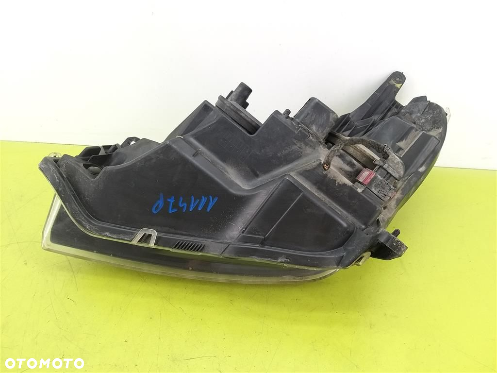 Reflektor lampa przód prawa Opel Astra III H 2004-2013 HELLA  1EG27037002 - 2