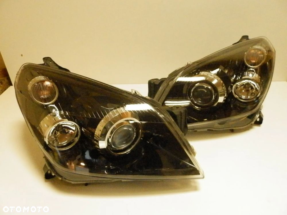 LAMPA LAMPY REFLEKTORY XENON OPEL ASTRA III H KOMPLET L + P EUROPA ORYGINAŁ