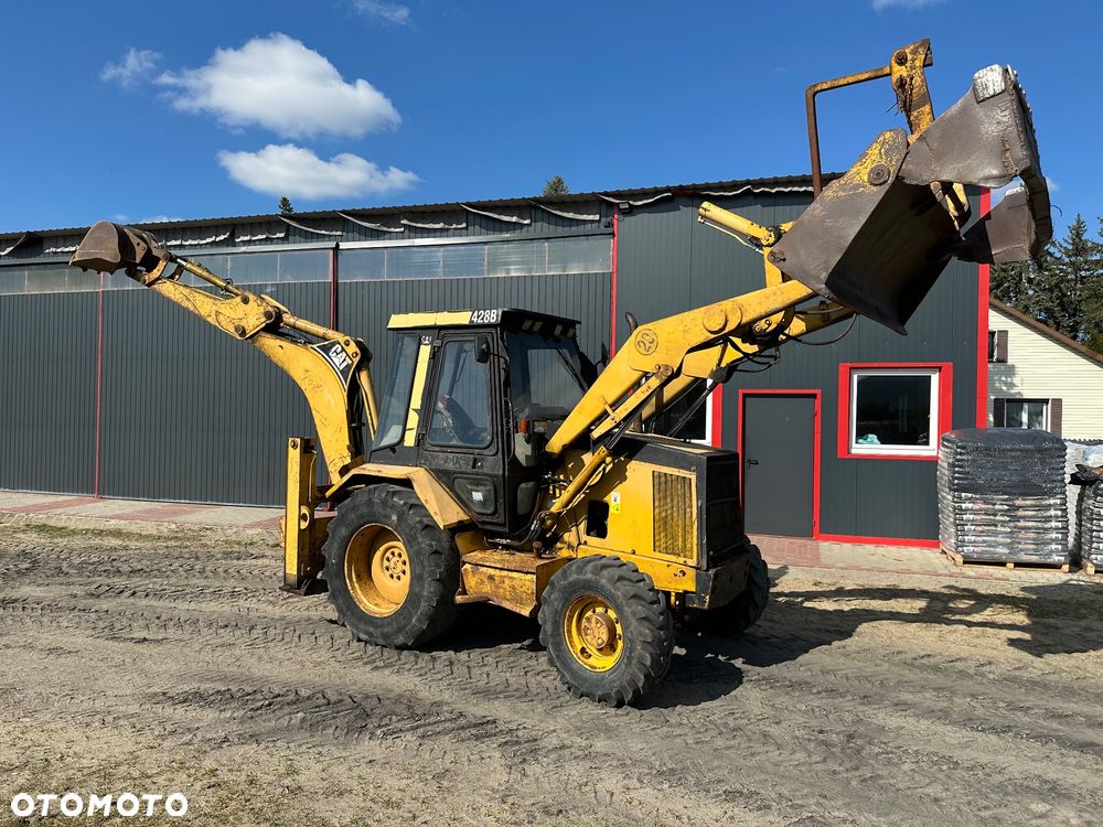 Caterpillar 428B ramię typu Banan - 1