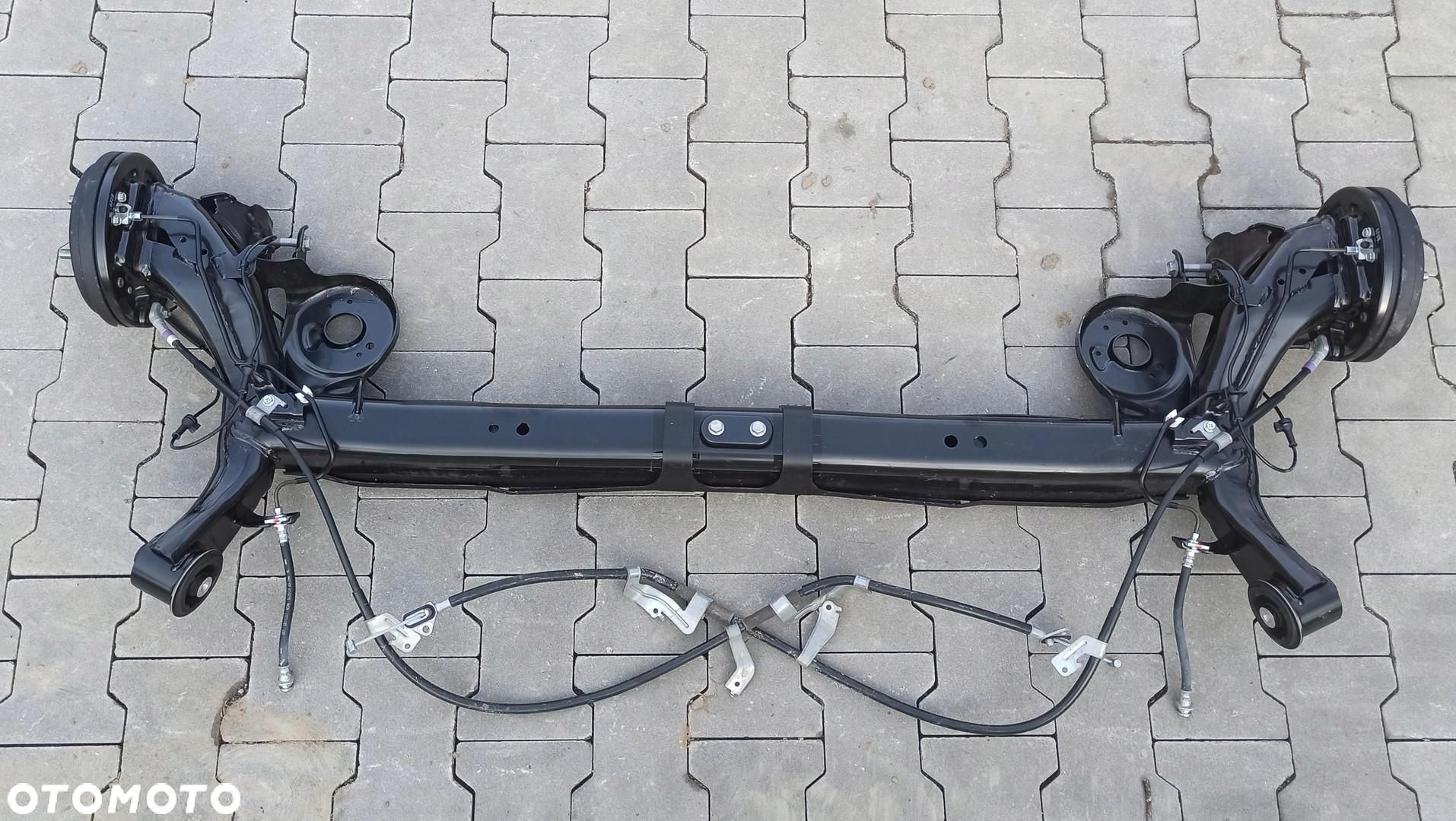 SUZUKI SWIFT VII MK9 BELKA ZAWIESZENIE TYŁ 1.2 800KM - 1