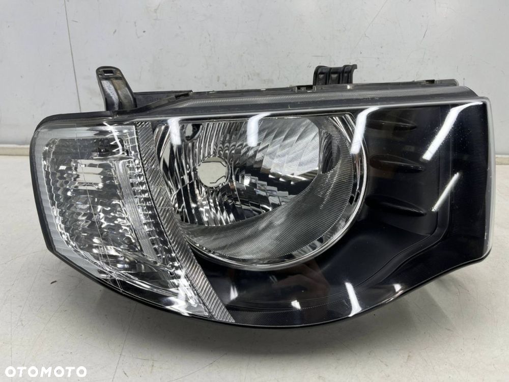 Lampa reflektor Mitsubishi L200 KA KB 05-10r. PRAWA przednia H4 oryginalna prawy przód EU 8301b462 - 1