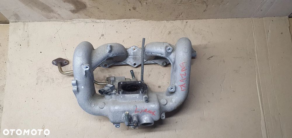 Kolektor ssący Suzuki Liana 1.6 16V E1T26571A - 2