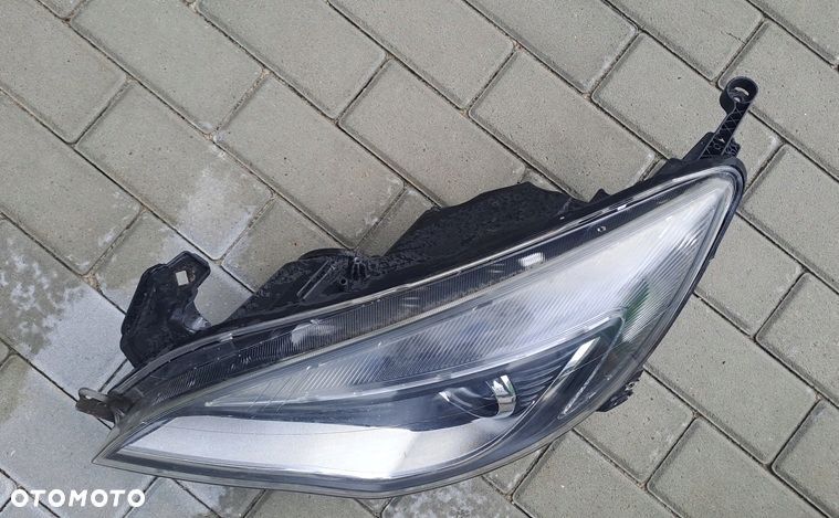opel astra j 09-15r lampa reflektor lewy przód bi-xenon skrętny eu 13374517 - 2
