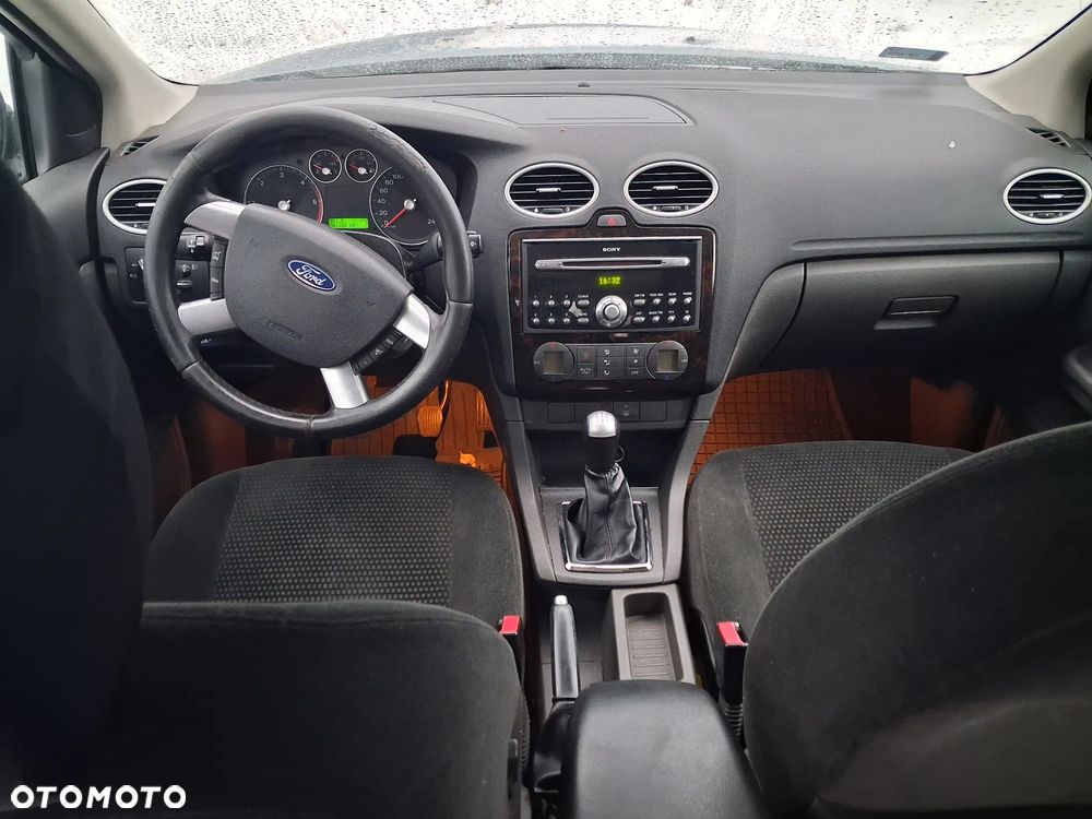 Ford Focus Mk2 II Ghia Konsola panel środkowy dekory drewno Radio SONY kierownica multifunkcja skóra poduszka Air Bag tunel środkowy przełączniki kratki nawiewu schowek panel nawiewu podłokietnik - 1