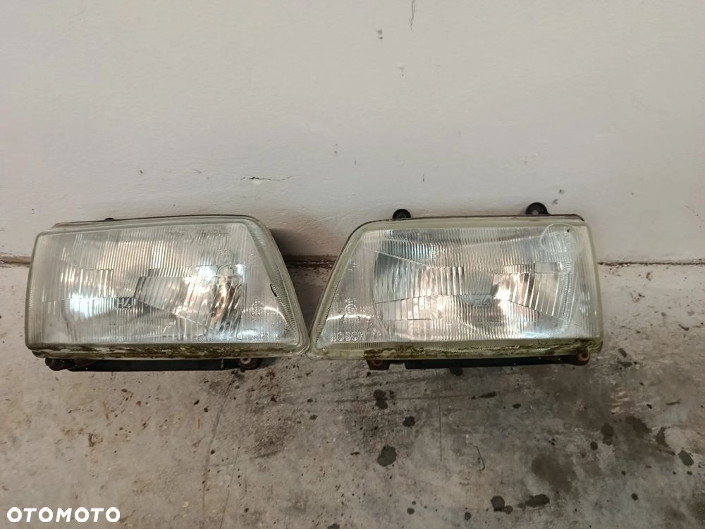 Lampy lampa przód prawa lewa Opel Frontera A
