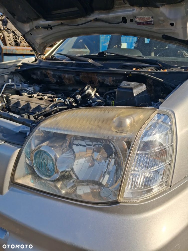 Nissan x-trail 06 reflektor lewy - 2