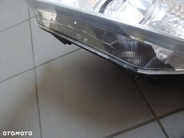 Lampa lewa  Skoda Fabia 2 5J1 941 015A BI-HALOGEN - 6