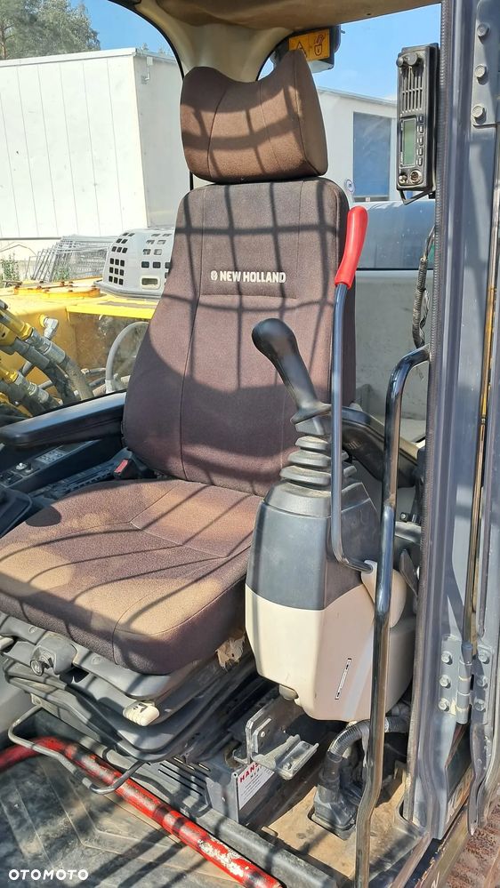 New Holland E 265 C - 11