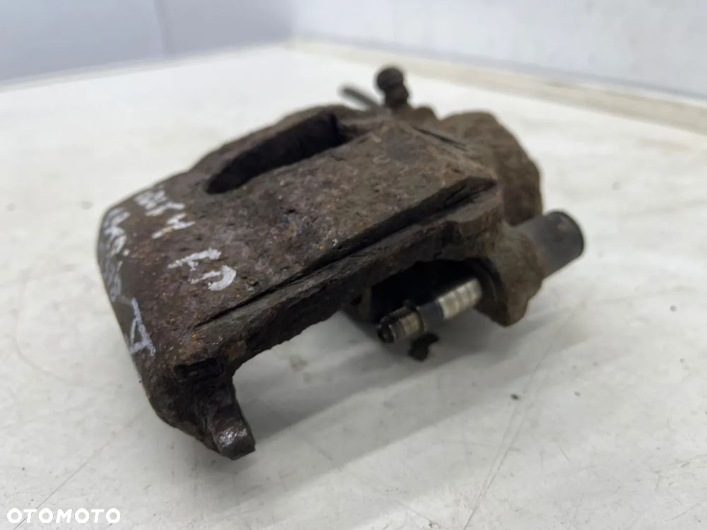 Zacisk hamulcowy VW Golf IV V VI Polo III IV Audi A3 8l 8p Leon I II Ibiza III IV Fabia I II III Octavia I II Caddy III 97-12r. prawy przedni jarzmo - 21