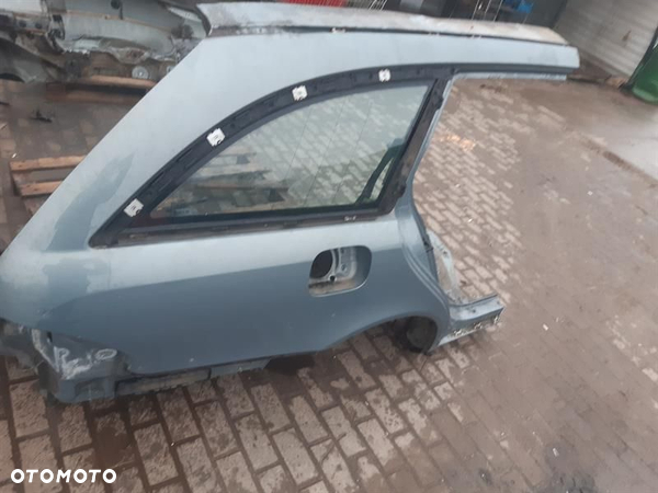 BŁOTNIK PRAWY TYLNY Mercedes E 2004r.