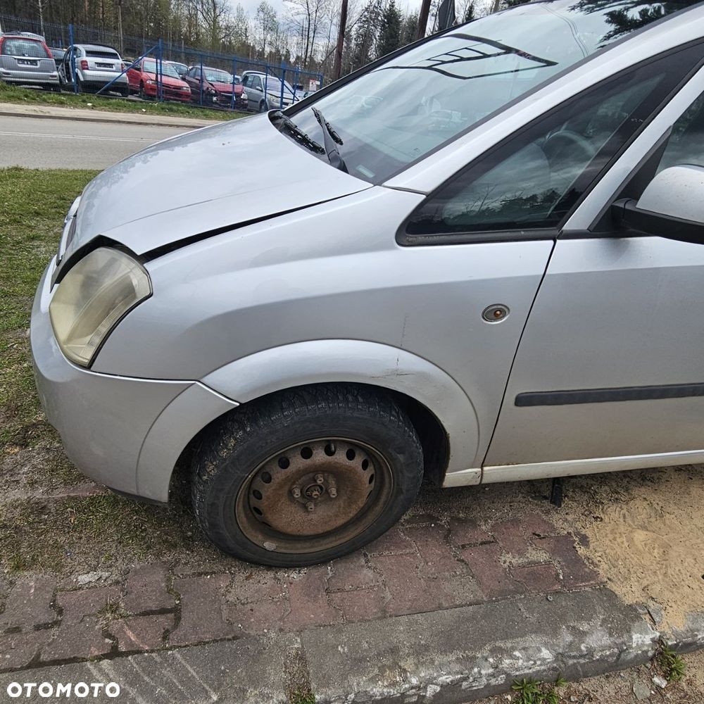BŁOTNIK BŁOTNILI / PRAWY LEWY /  OPEL MERIVA (2004r) kod lak: Z157 - 1
