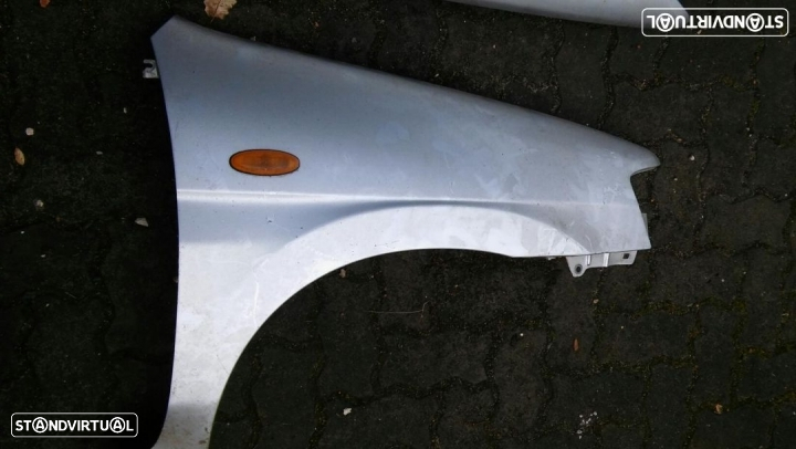 Guarda lamas condutor mazda demio - 3