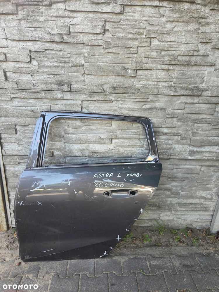 Drzwi Opel Astra L Kombi tył lewy - 1