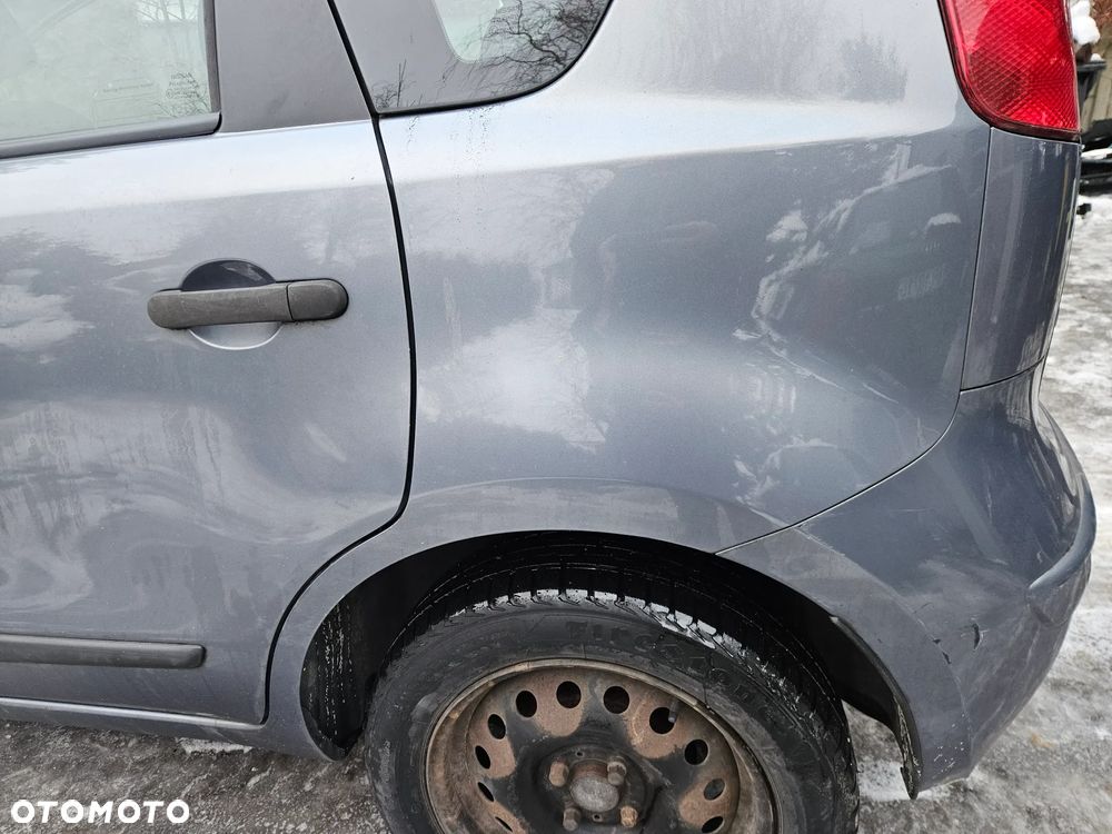 Nissan Note E11 07 błotnik tył tylny  prawy lewy B52G - 1