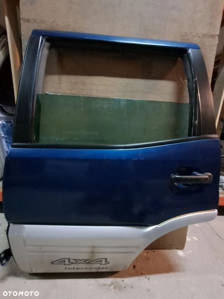 Drzwi Nissan Terrano II 93-03' lewy tył (granatowe)