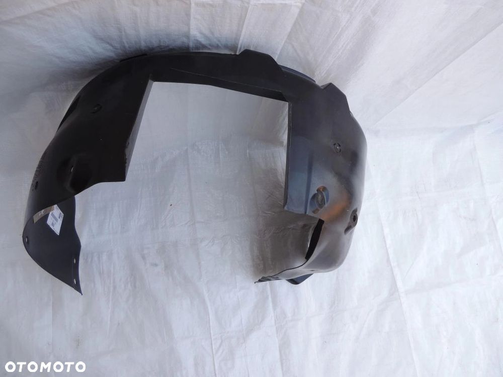 Nadkole lewy przód 13109022 Opel Corsa C nowe oryginał - 2