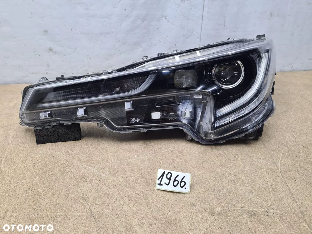 Toyota Corolla E21 kombi/HB  lampa lewy lewa  przód używana 81170-02585 - 1