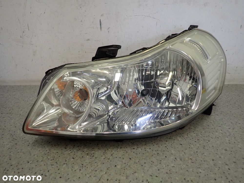 SUZUKI SX4 FIAT SEDICI 06-13 LAMPA PRZEDNIA LEWA REFLEKTOR - 1