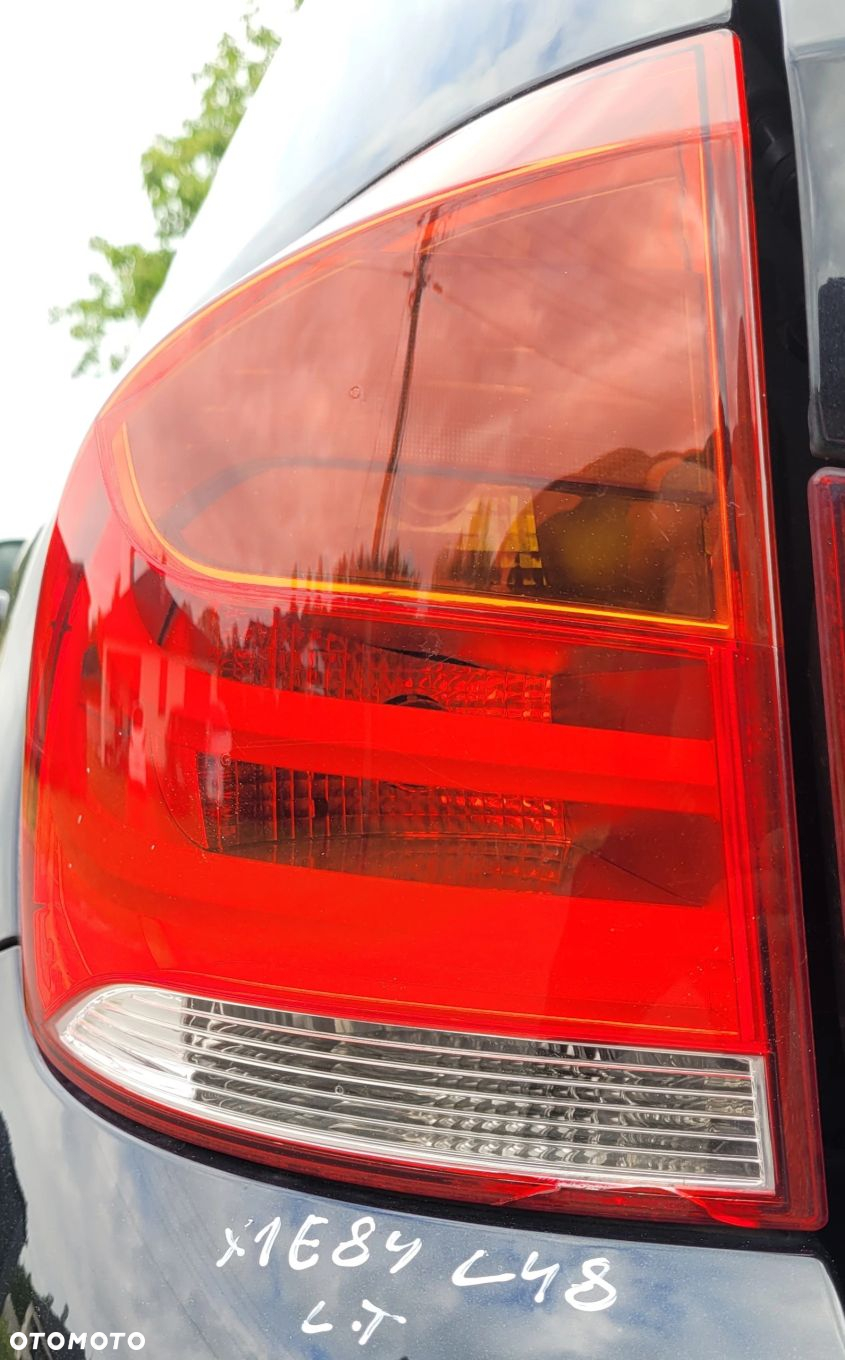 LAMPA W BŁOTNIK LEWY TYŁ TYLNA BMW X1 E84 - 2