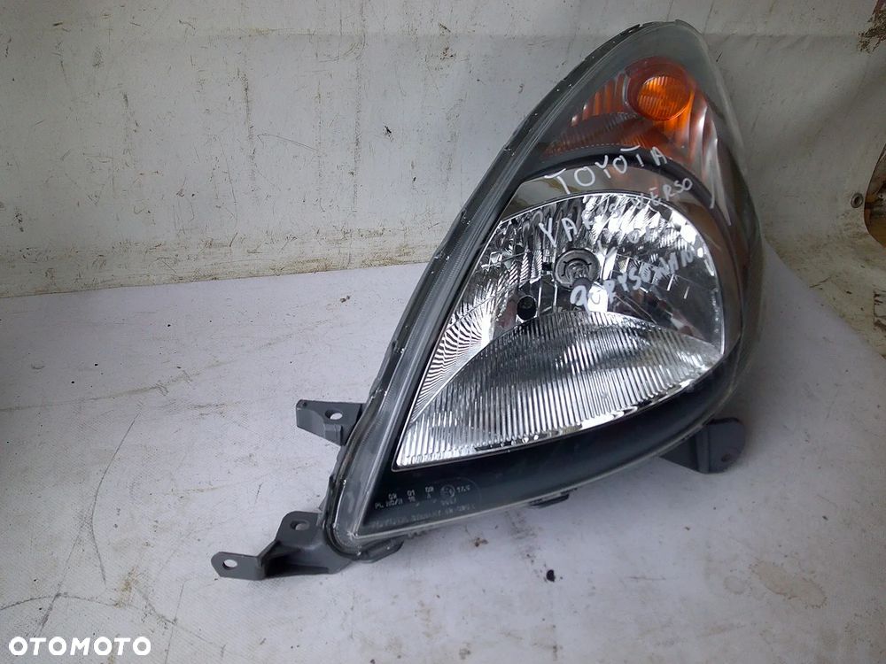 toyota yaris verso lampa przód lewa przednia nowa oryg - 8