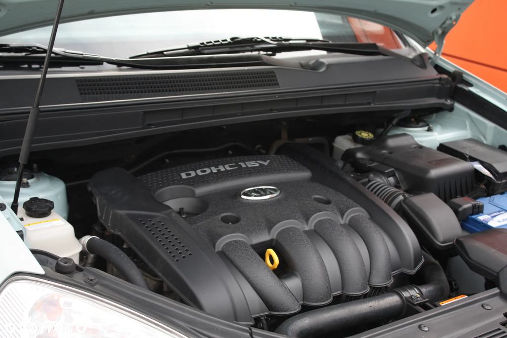 Kia Carens 2.0 CVVT LX - 33