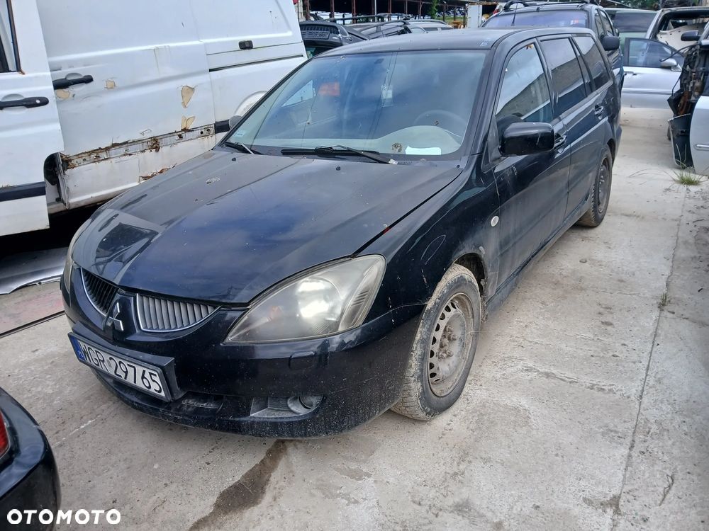 mitsubishi lancer VII fotel kanapa deska kokpit podsufitka boczek podłokietnik licznik panel szyb - 1