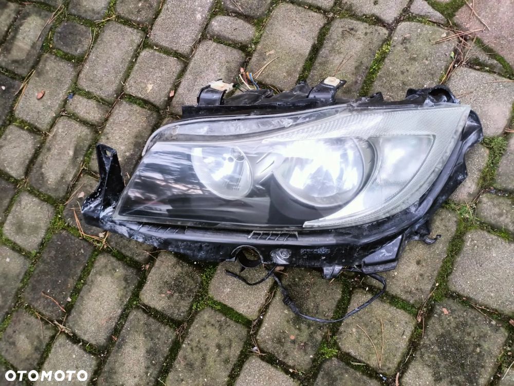 Lampa przód przednia lewa BMW E90 E91 przed lift ZKW Europa h7