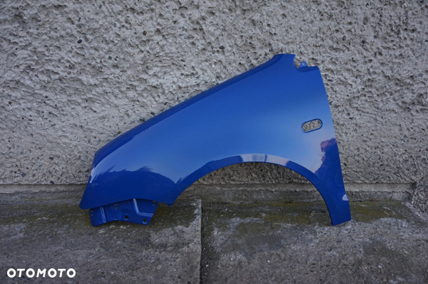 BŁOTNIK PRZÓD LEWY VW POLO 9N OKULAR LW5Z 01/05r
