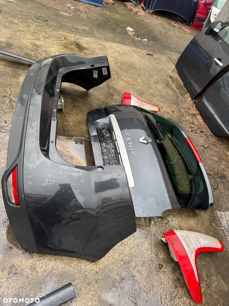 Renault grand scenic 3  grandscenic TEB66  / EA3 / Jz1V / TLALLE / SZHR / SAN513 // D22240 drzwi prawe lewe przednie tylne tył przód kompletny przód grand Scenic 3 szary ciemny drzwi prawe lewe lusterko składane zderzak tył tylni klapa bagażnika klapa tył lampy tył tylnie prawa lewa belka tylnia Podszybie kompletne osłoną słupka prawa lewa zawiasy maski prawy lewy wąż węże klimy podstawa akumulatora zbiorniczek spryskiwaczy filtr powietrza belka dolna przednia na dole zbiorniczek płynu chłodzącego  Lampa prawa lewa bixenon xenon 08120 /260100027r / 89902929  błotnik przód przedni prawy lewy maska pas przedni benzyna tce 130 benzyna zderzak przód przedni pdc 4 czujniki spryski Zenona komplet - 21