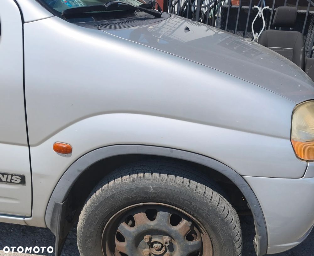 SUZUKI IGNIS I 02r BŁOTNIK PRAWY PRZÓD PRZEDNI - 1