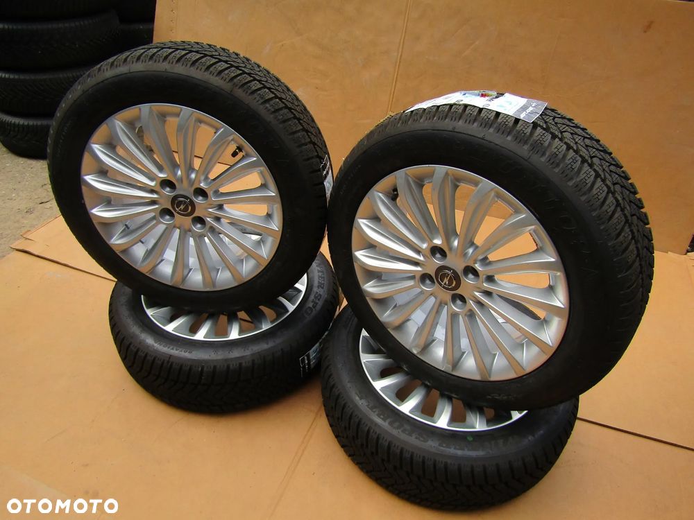 4x Felgi Aluminiowe Koła 16 Opel Adam Astra H Corsa D E Meriva Combo C Karl Chevrolet Aveo Fiat Grande Punto Evo 6,5 j ET40 + Opony 195/55 16 Dunlop Zimowe + Czujniki TPMS - 16