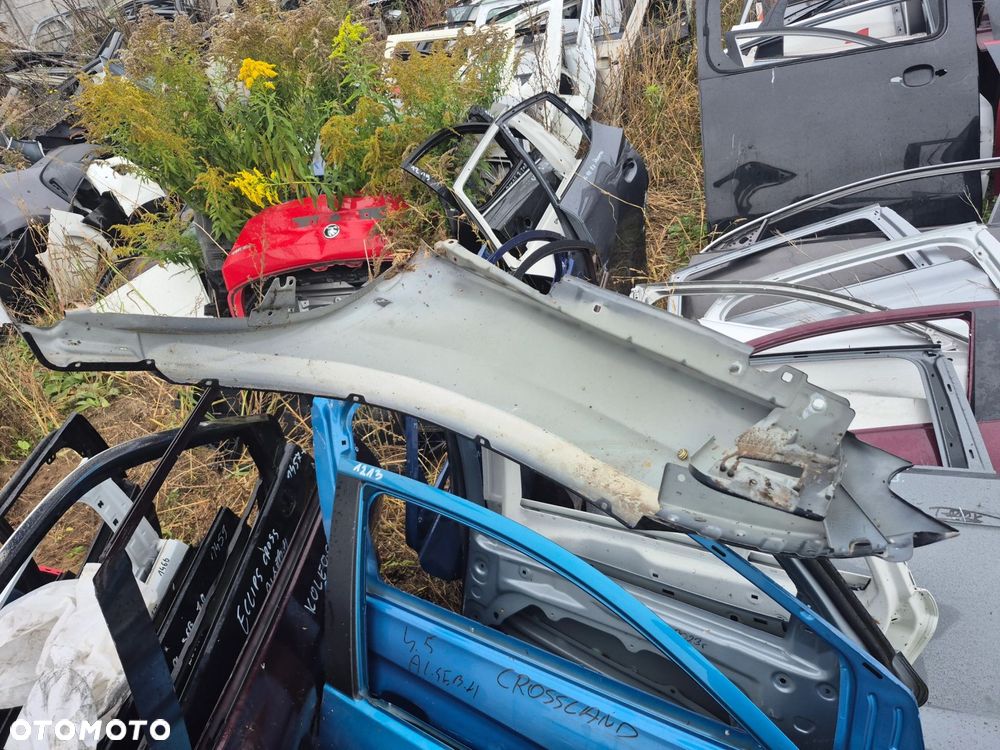 Błotnik Dacia Duster I 2010-2017r. Przód Lewy - 2