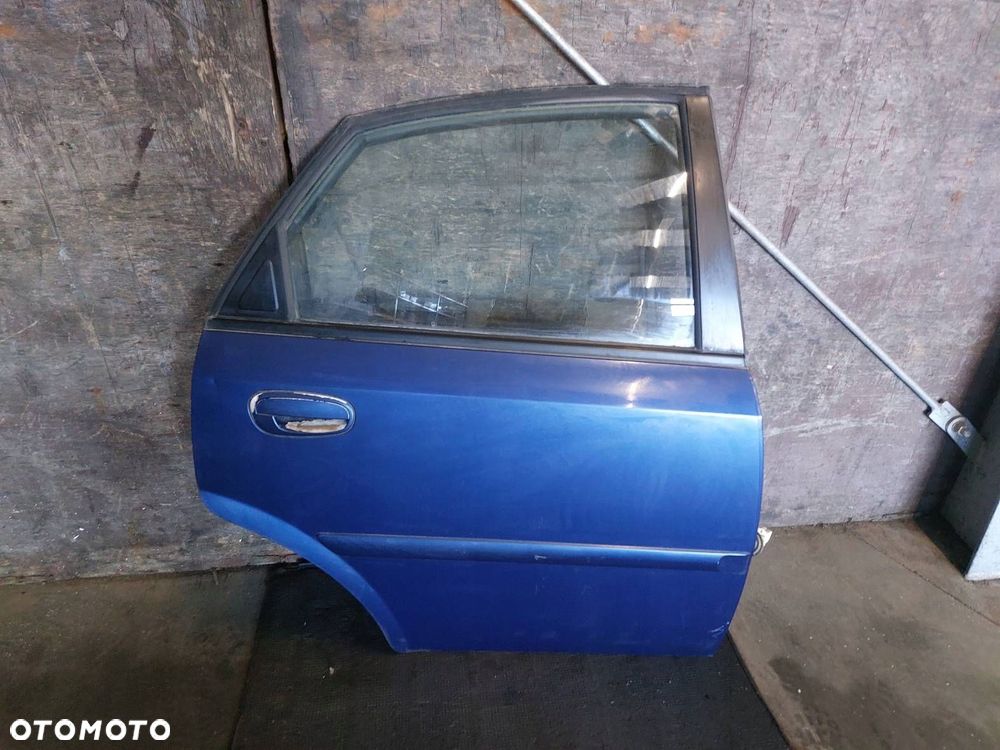 DRZWI KOMPLETNE PRAWY TYŁ NUBIRA II J200 SEDAN NIEBIESKI - 1