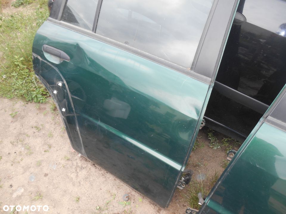 Drzwi prawe tył tylne Nissan Patrol Y61 lift GU4 3,0 Diesel - 3