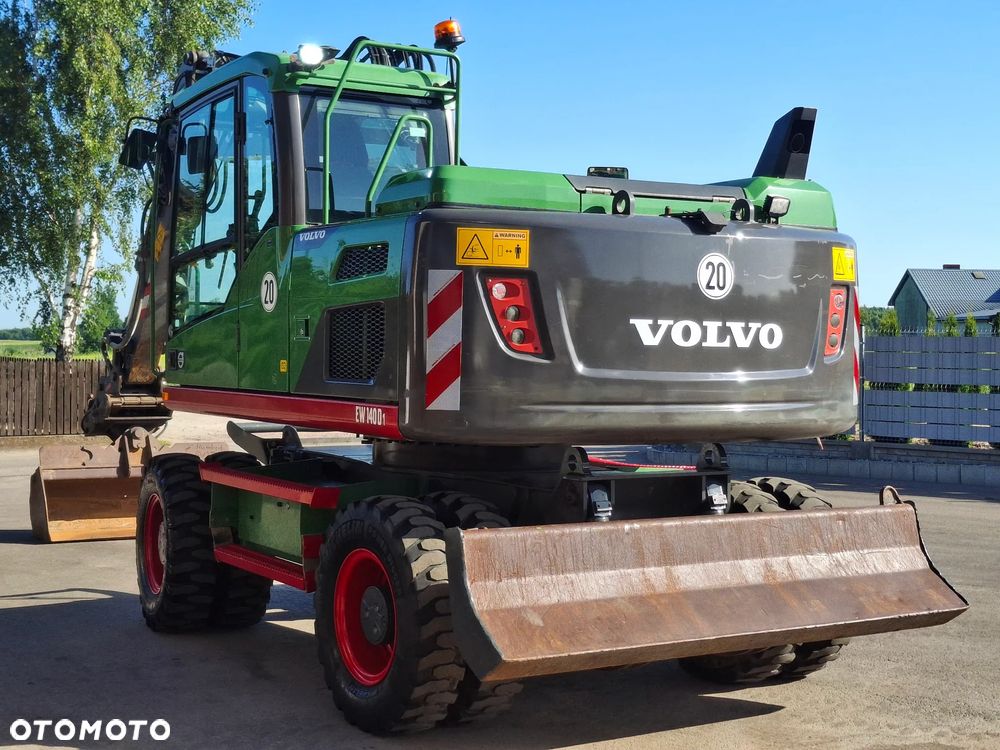 Volvo EW 140D Koparka Kołowa OilQuick Szybkozłącze Podwójne Koła 2015 Rok 2439 MTH Moc: 204 KM Dodatkowa Łyżka Pług Bardzo Dobry Stan Sprowadzona - 2