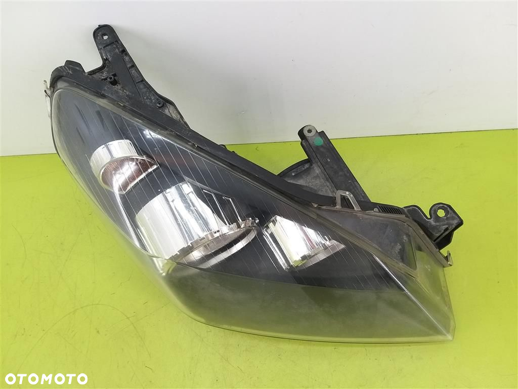 Reflektor lampa przód prawa Opel Astra III H 2004-2013 HELLA  1EG27037002 - 10