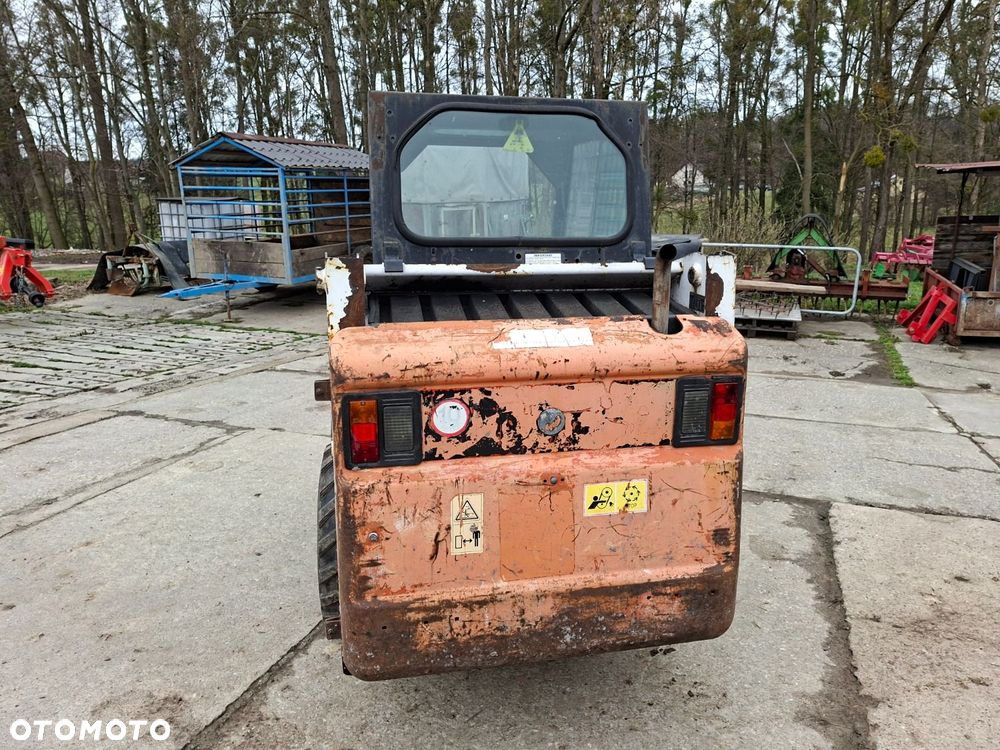 Bobcat 553 4X4 + Melroe Ingersoll-Rand 725S B/H - 7