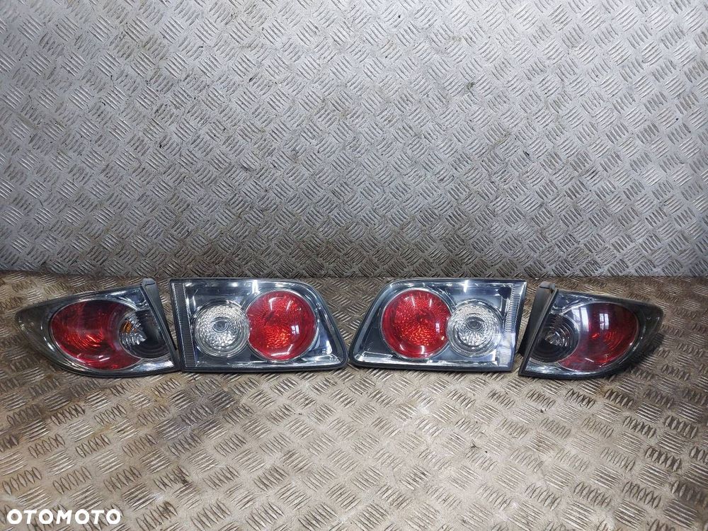 LAMPA LEWY TYŁ + PRAWY TYŁ W BŁOTNIK W KLAPĘ MAZDA 6 I GY KOMBI - 1