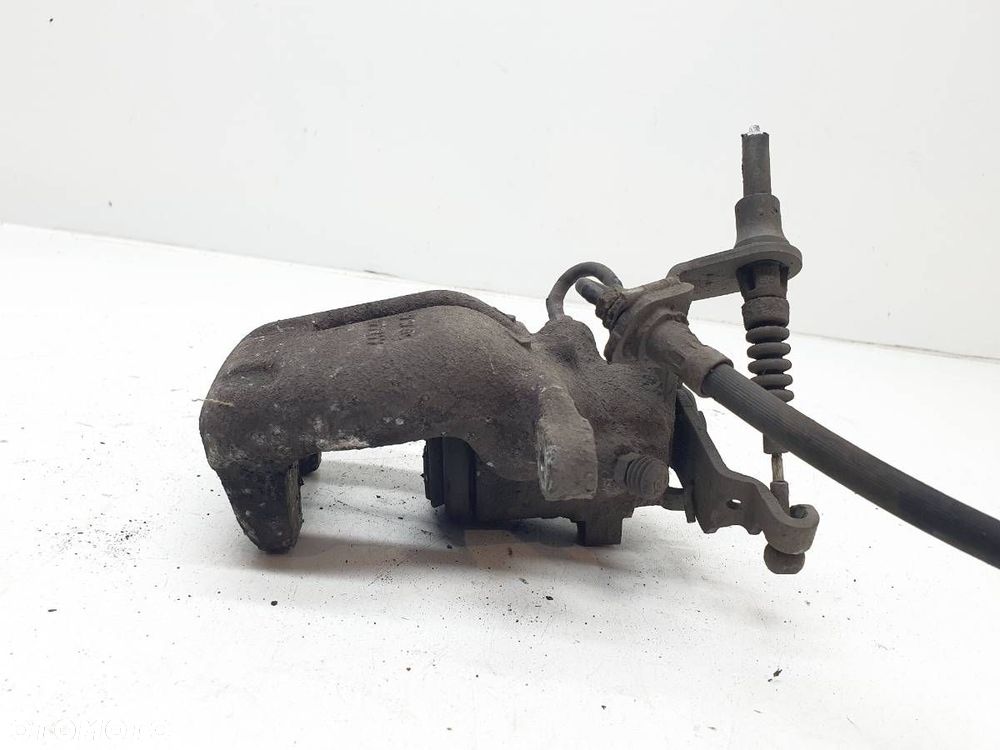 ZACISK HAMULCOWY TYŁ LEWY SKODA OCTAVIA II EU - 3