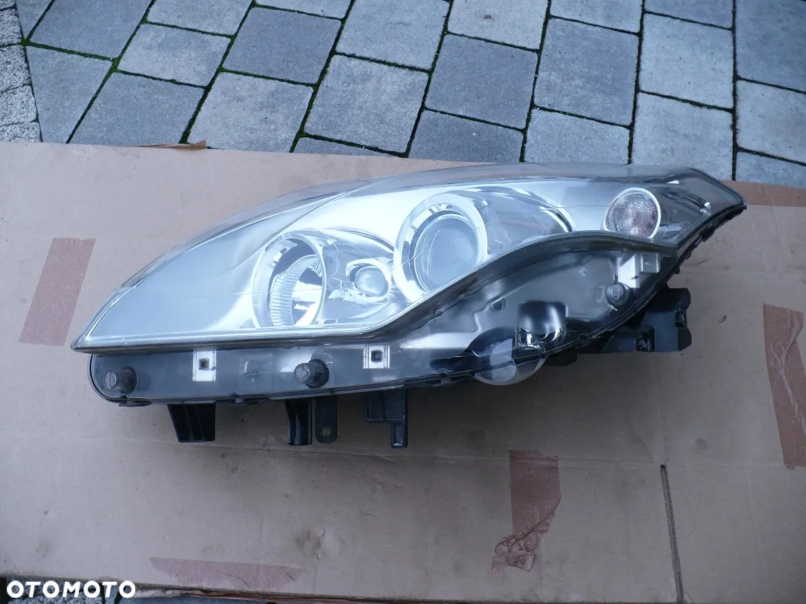LAGUNA 3 III 260600033R LAMPA SOCZEWKA L. ORYGINAL EU. - 2