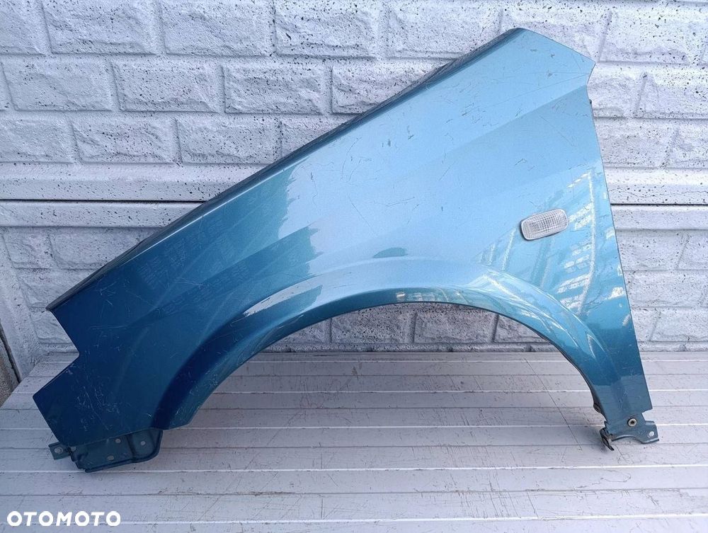 NISSAN PRIMERA BŁOTNIK LEWY PRZÓD