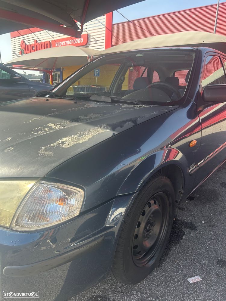 Mazda 323 1.3 - 8